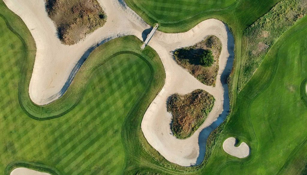 aerial-view-of-the-green-grass-of-the-golf-course-2000-WL